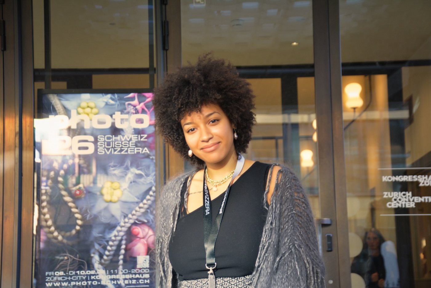 Christin Khaukha outside the Kongresshaus beside the photoSCHWEIZ 26 poster