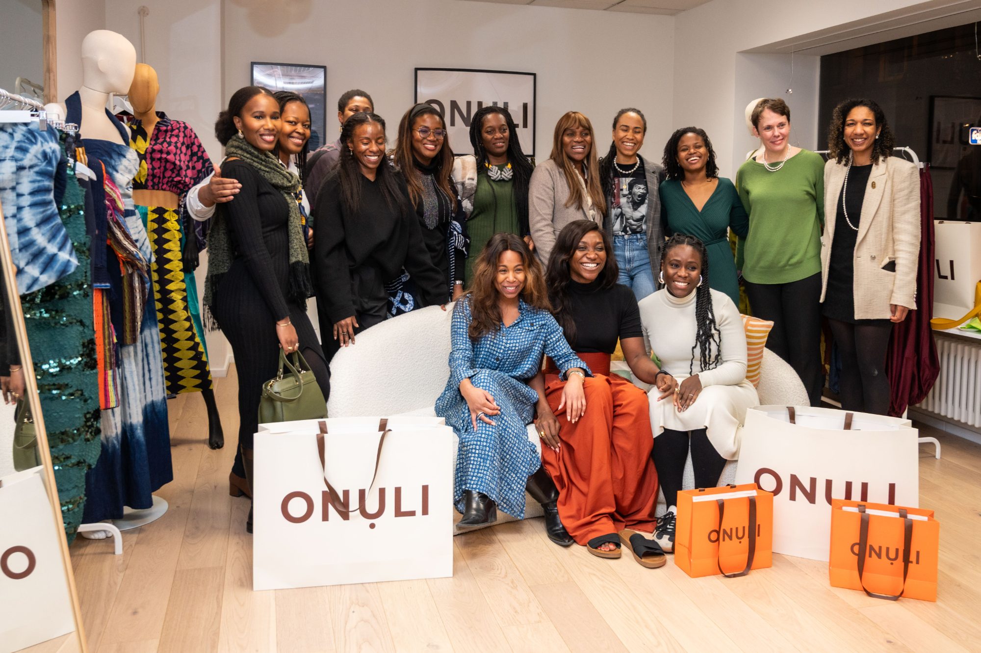 AfroSwissters guests together at the Onuli pop-up in Zürich, with Onuli shopping bags in front