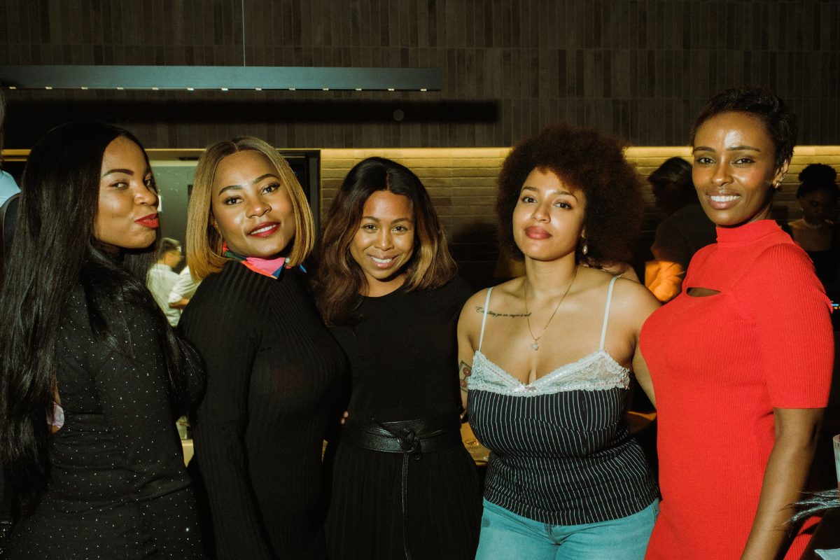 Five guests posing together