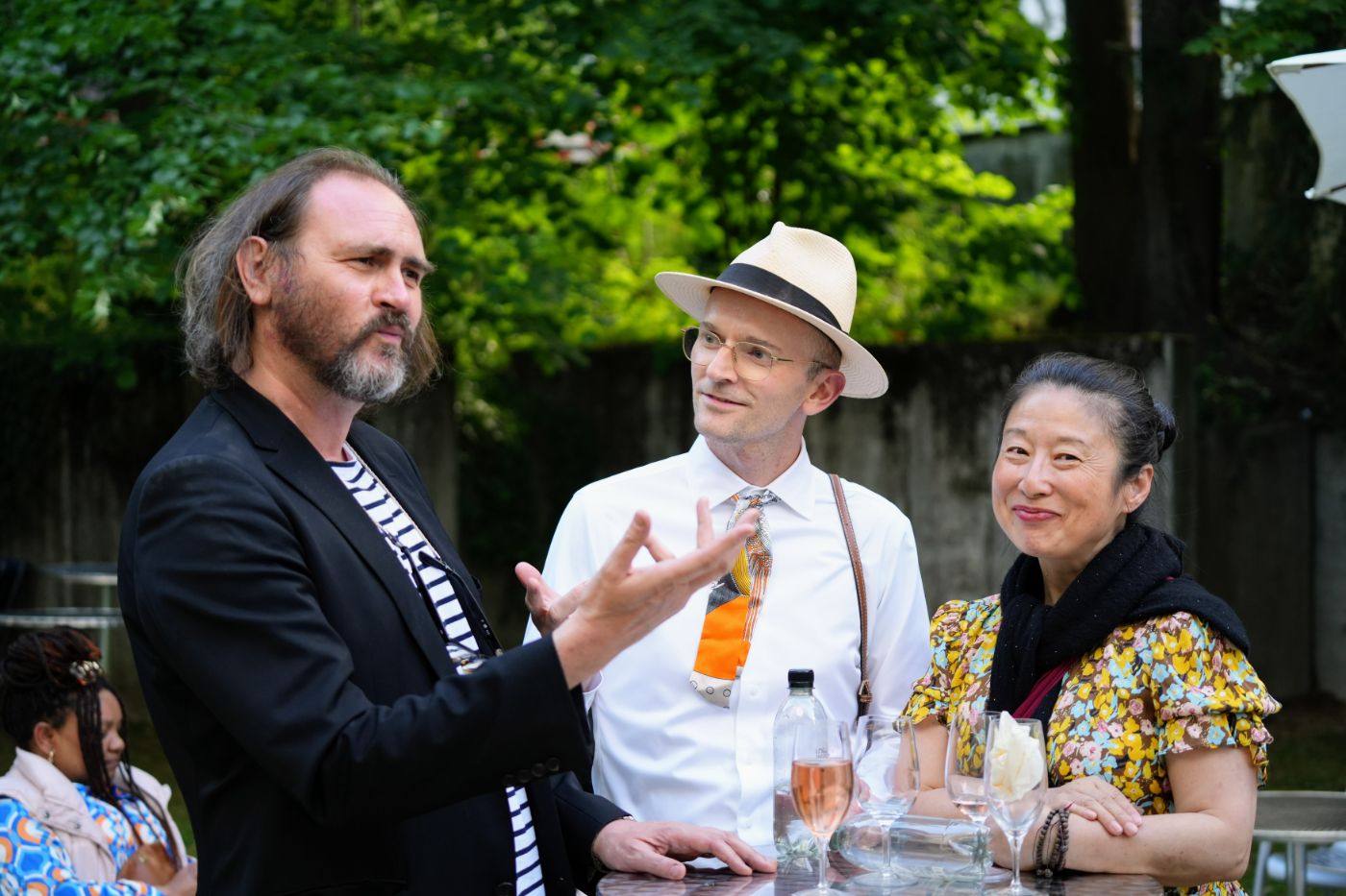 Guests talking in the garden