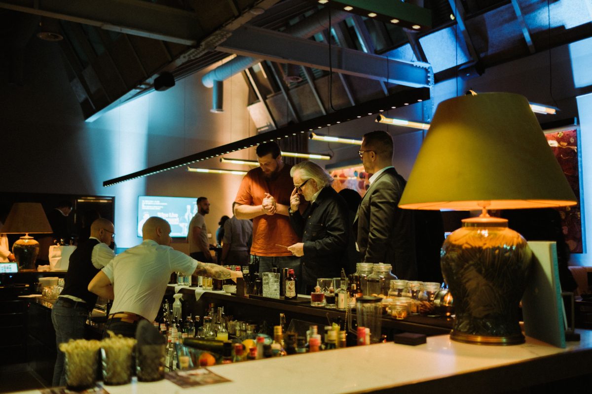 Guests and bartenders at the bar