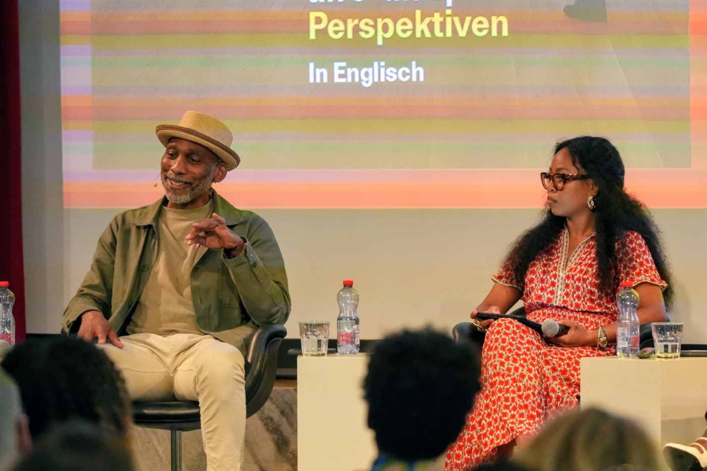 Two speakers on stage during the panel talk