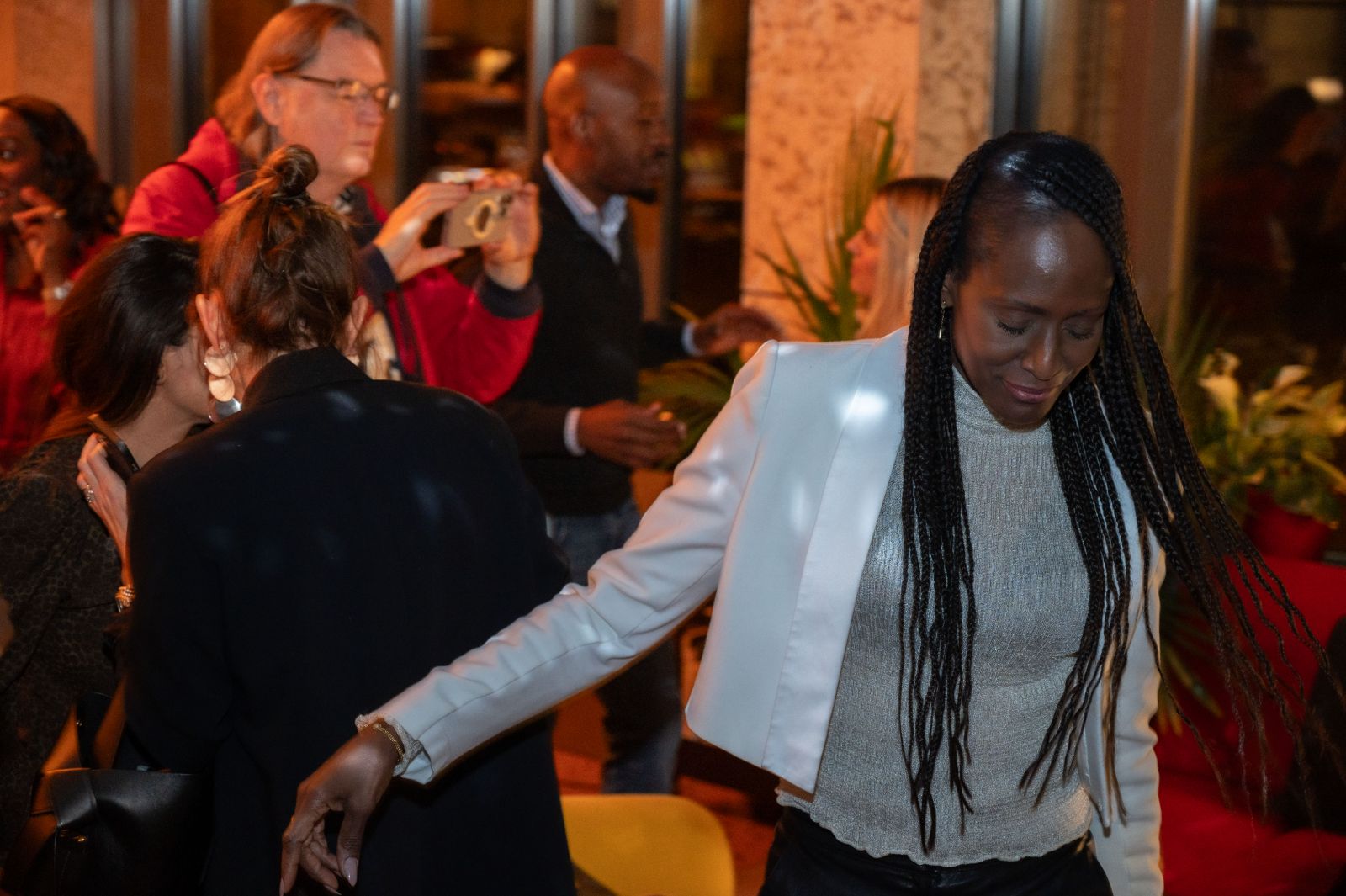 A guest with long braids dancing
