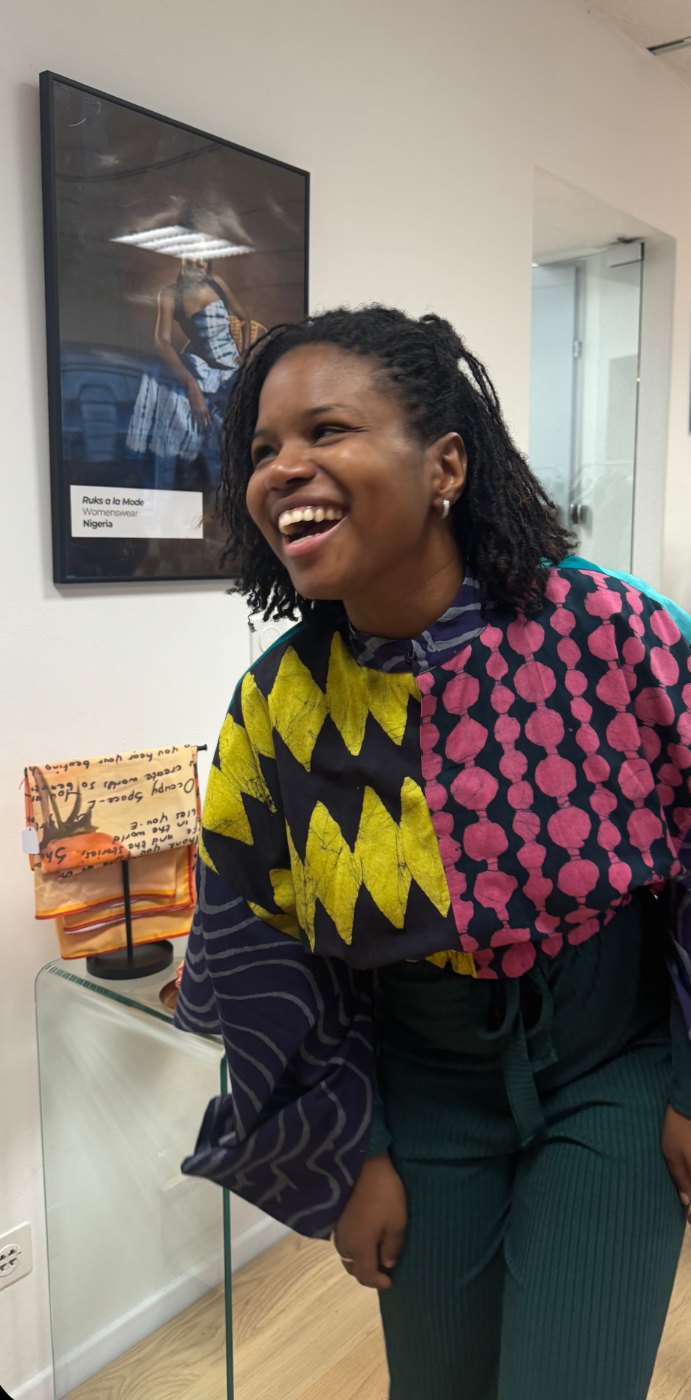 A guest in a colourful patterned top laughing