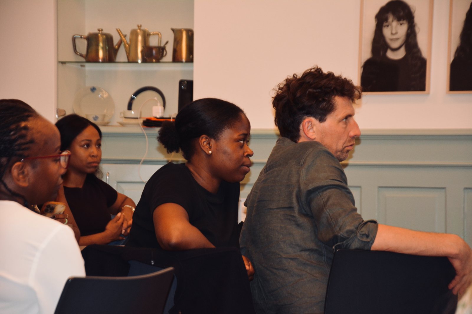 Participants listening, seen from the side