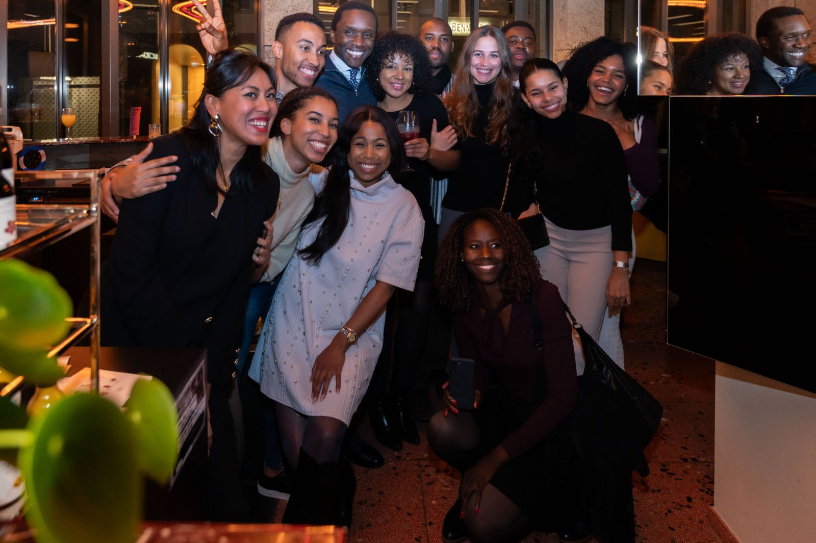 A large group of guests posing together for a photo