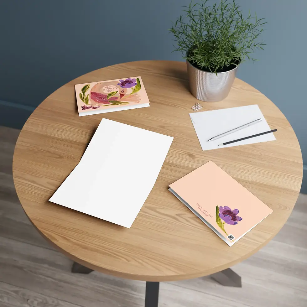 folded greeting card with blank interior and printed back on a table ready to write mothers day greetings