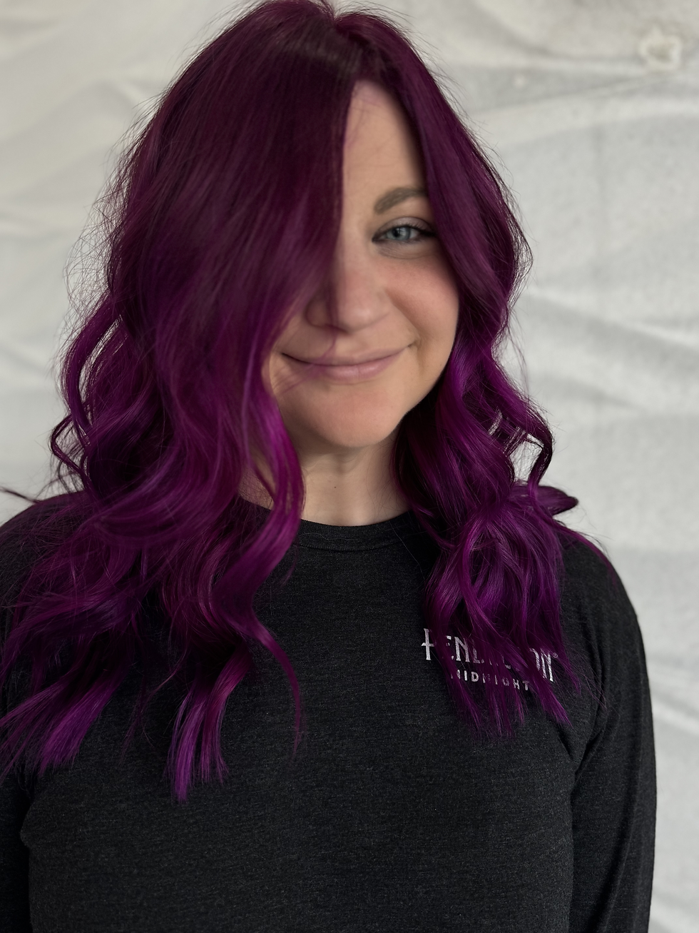 Vibrant fashion hair color with pink purple and blue tones by Fort Myers color specialist
