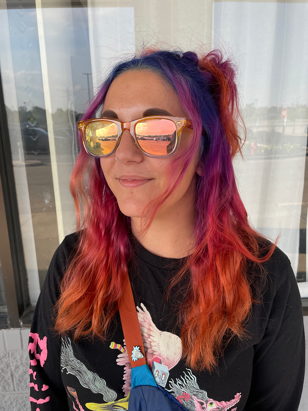 Vibrant fashion hair color with pink purple and blue tones by Fort Myers color specialist