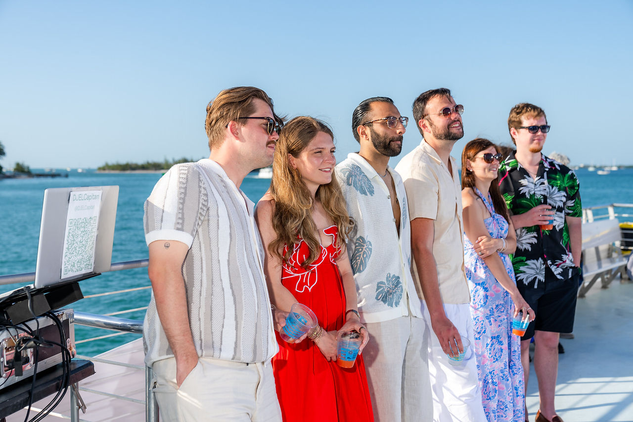 Friends and family watch a wedding take place on a boat in Key West