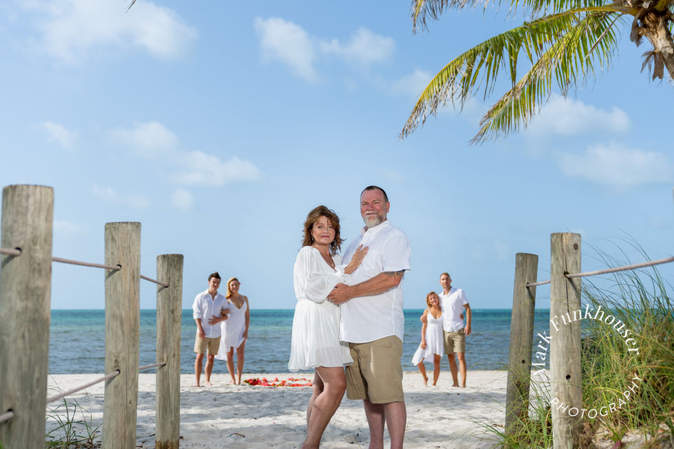 Parents and their children having family photos taken at the beach in Key West