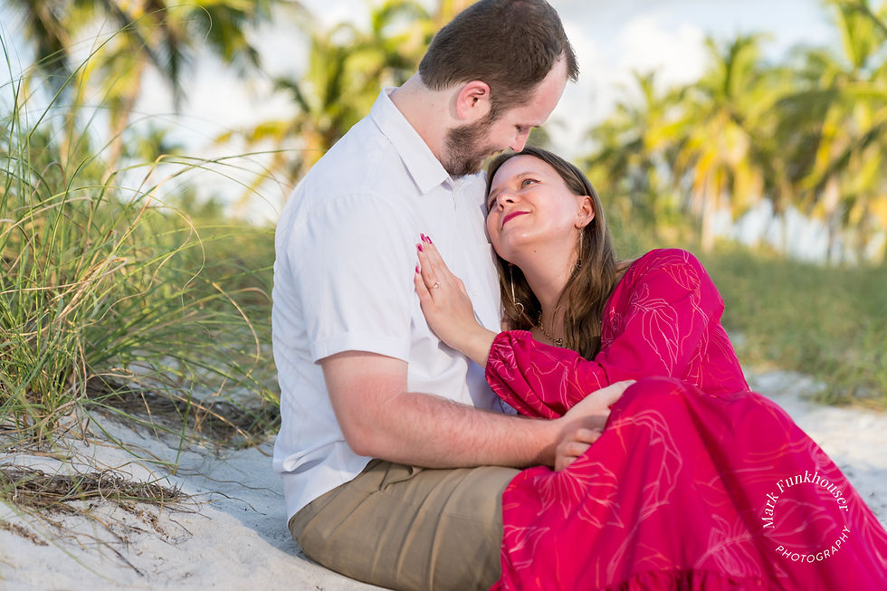 A couple on Smathers Beach in Key West after their engagement proposal