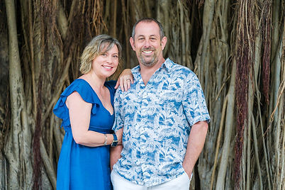 A man and woman stand in front of banyan tree for Key West engagement photography
