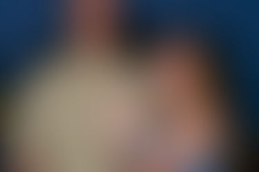A woman is showing her engagement ring so it can be photographed as part of their Key West proposal photography session