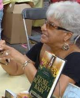 Sandra Belton signing books