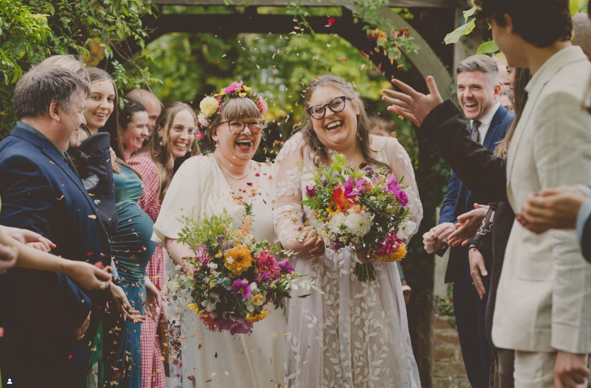 Happy wedding brides with beautiful flowers