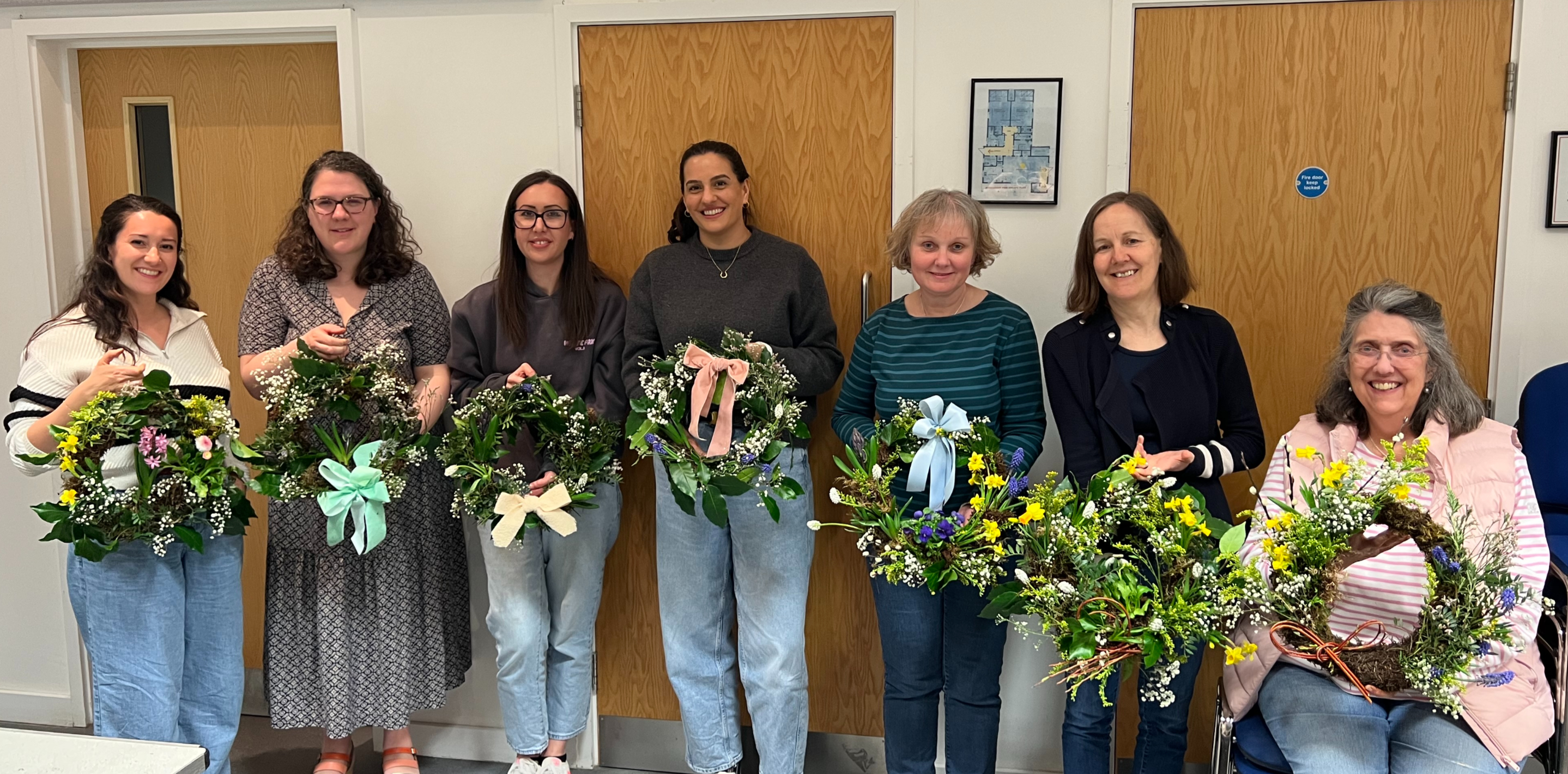 A collection of beautiful, finished spring wreaths from a workshop