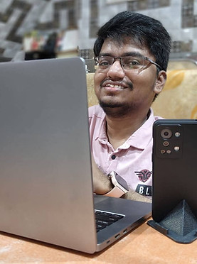 Shubham Kamble using laptop