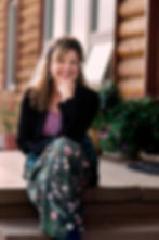 alt="Dayle Hudson with family, embracing connection and nature as core therapy values"