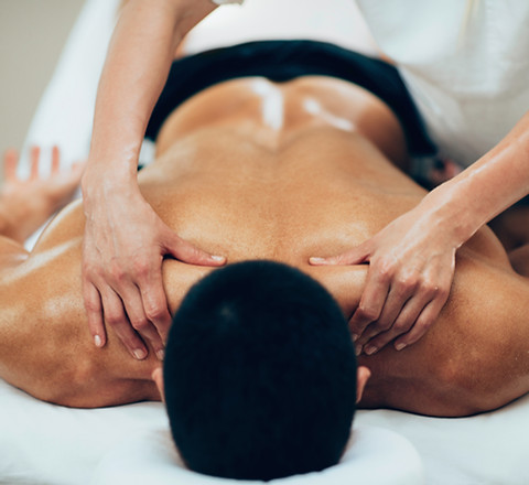 Sports massage. Therapist working with s