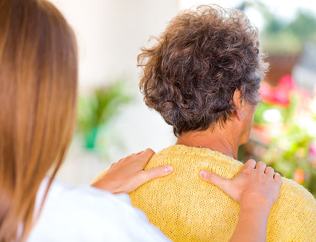 Photo of carer massage the elderly woman