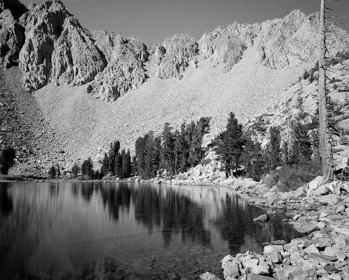 black and white photo of an alpine lake