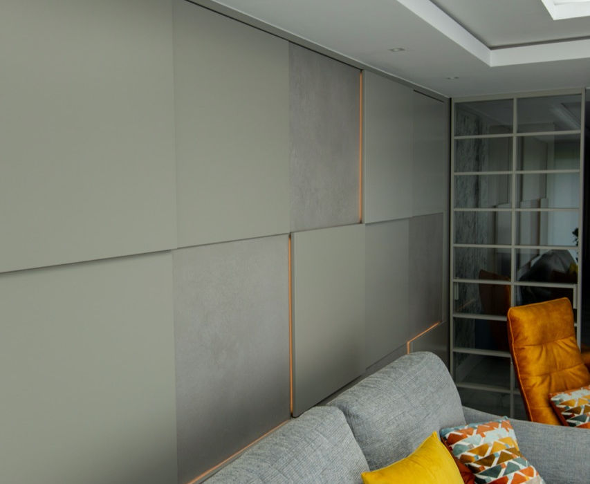 grey sofa in front of wall
