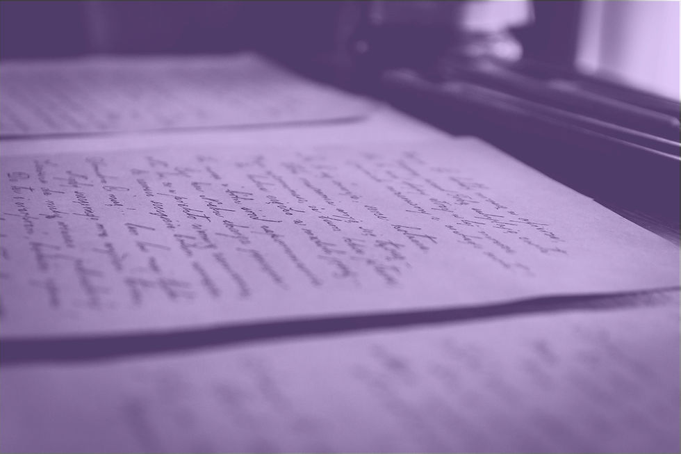 Blurred handwritten documents on a desk, tinted in soft purple tones.