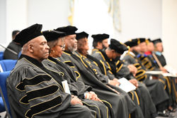 Graduates listen on intently