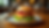 Eye-level view of a vibrant dish at Kurry Qulture featuring an innovative Vada Pav Burger