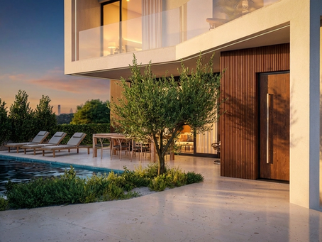 A render of a modern multi-story building with a swimming pool and lounge chairs outside, at sunset.