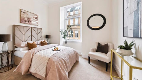 High-end master bedroom in a staged West End Glasgow home, featuring contemporary design, neutral colours, elegant furnishings, and luxury styling.