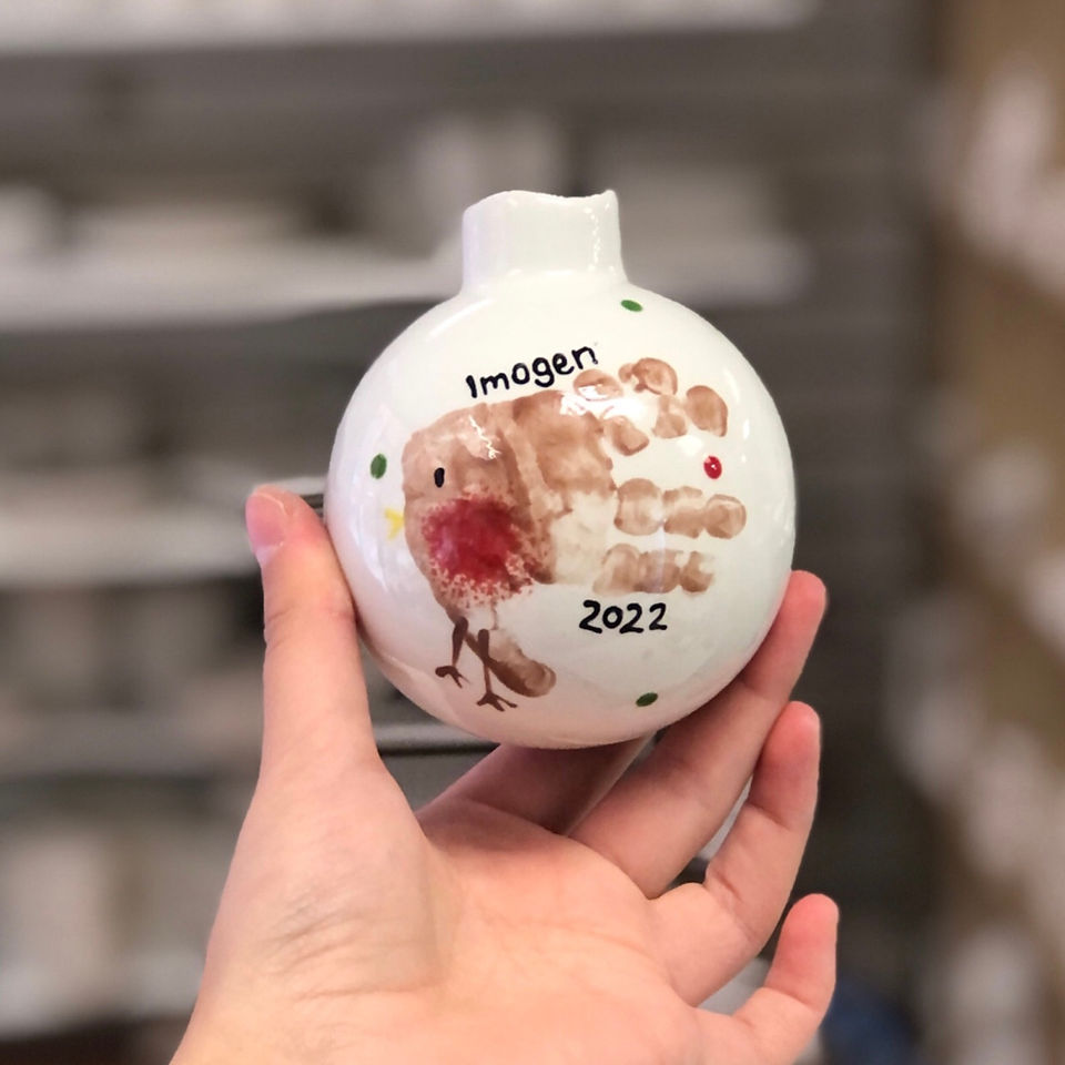 Handprint robin on ceramic bauble