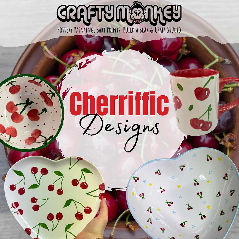 A bowl of cherries in the background with Cherrific Designs as the caption and heart plates a mug and a bowl all painted in our pottery painting studio with cherries.
