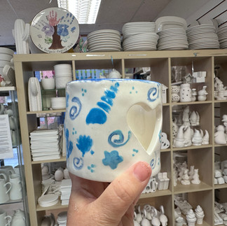 tea light holder painted with a sea shell theme