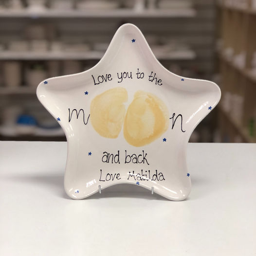 A star plate with the text 'Love you to the moon and back' The bumprint makes the middle of moon.