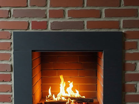 A lit gas fireplace insert that still needs regular venting inspection