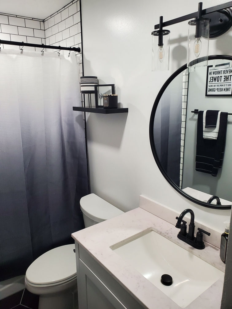 Bath with timeless subway tile walls and hexagon floor.