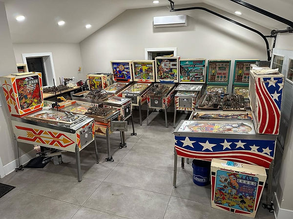 Vintage electro-mechanical pinball machines in restoration workshop at Pinball Resurrection in Feasterville Pennsylvania