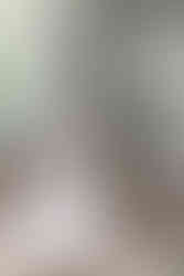 bride reading a card on a bench on her wedding day