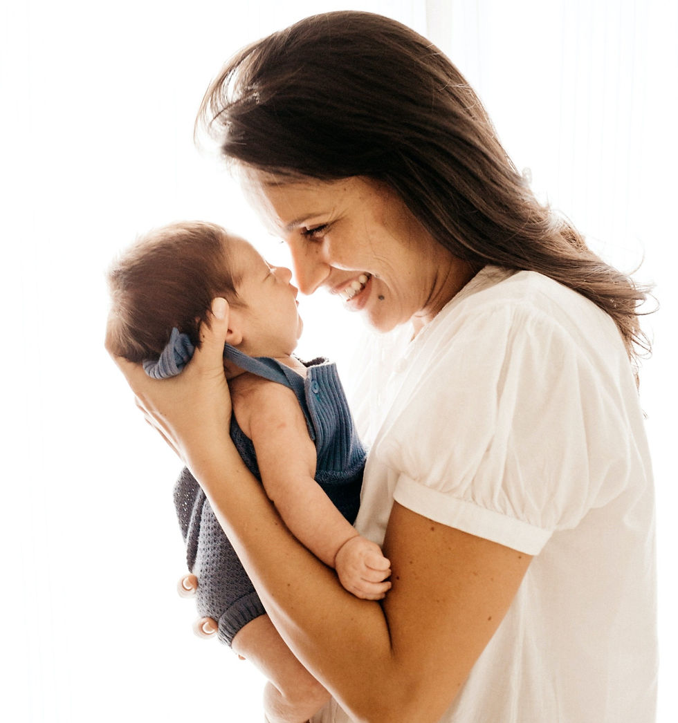 Mother smiling at young baby