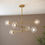 Thumbnail: Akira 6 Light Brushed Aged Brass Multi-Arm Pendant Light