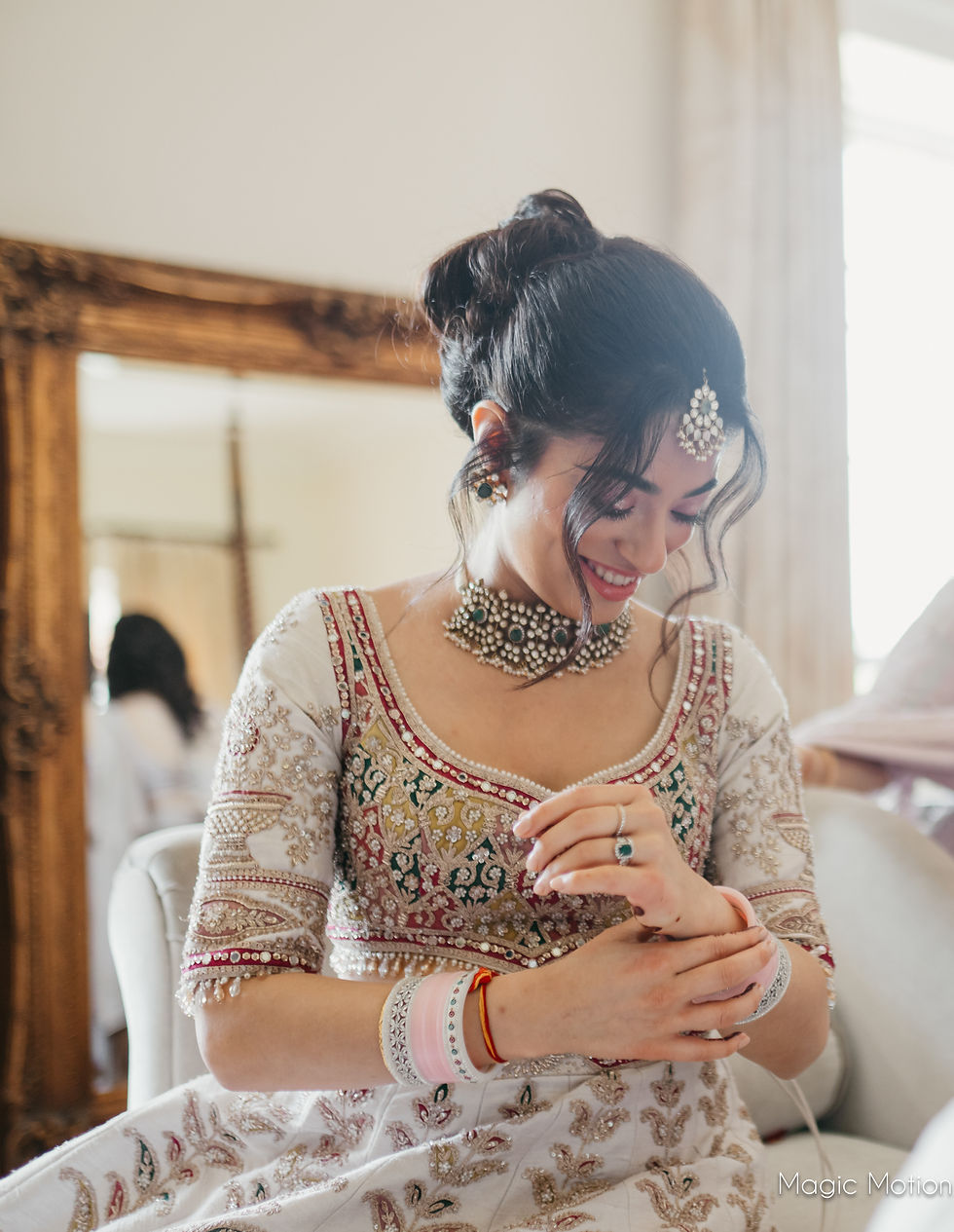 Indian Bride putting on her bangles