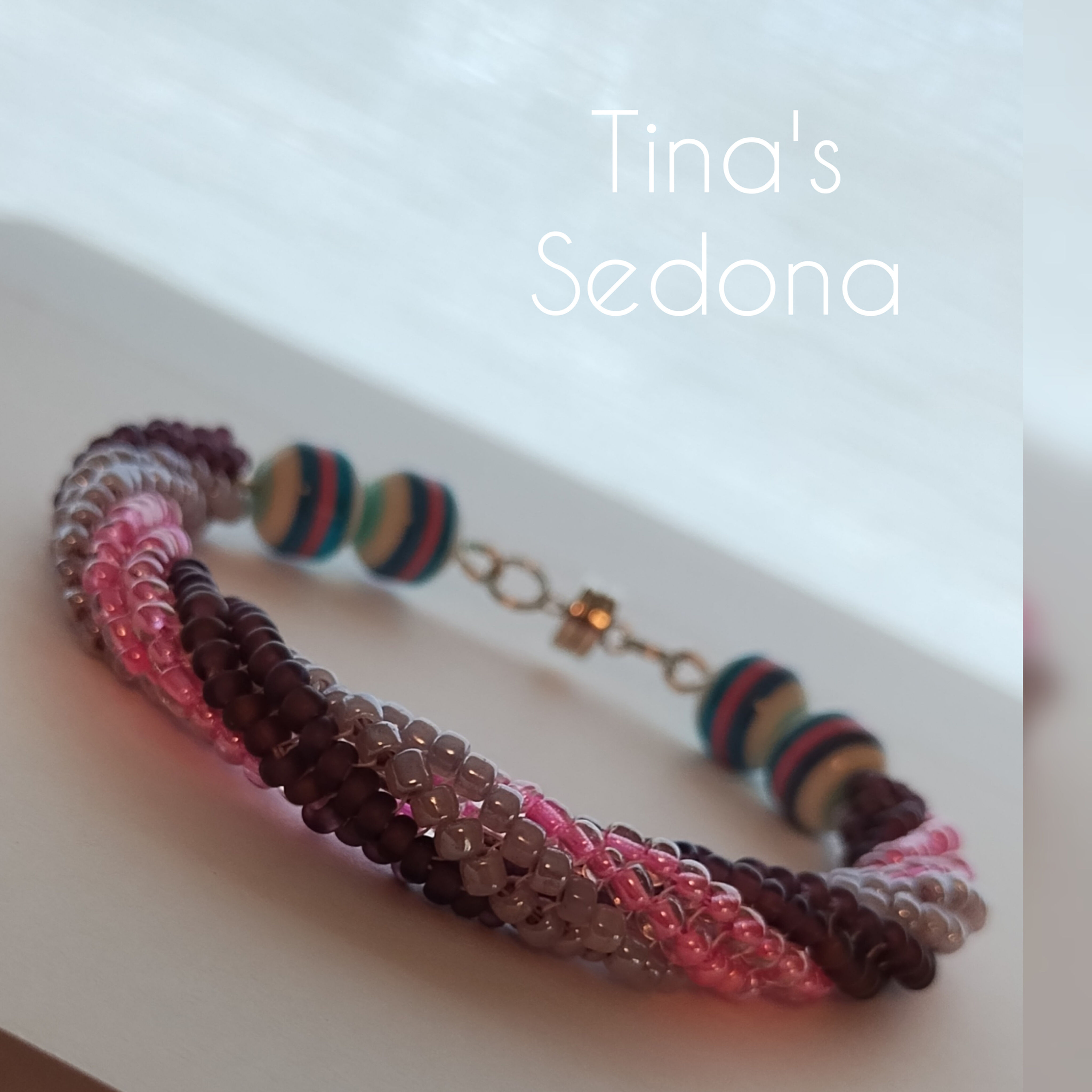 Handmade bracelet spiral of sparkly pink purples with silver magnet