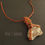 Thumbnail: Handmade wire woven necklace of smooth river stone