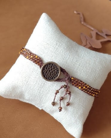 Thumbnail: Hand braided Kumihimo bracelet of bronze and maize