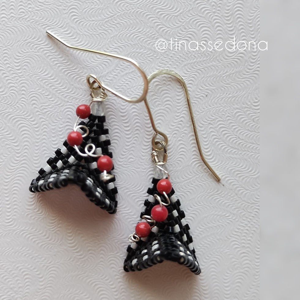 Hand woven black and white geometric earrings with red accents