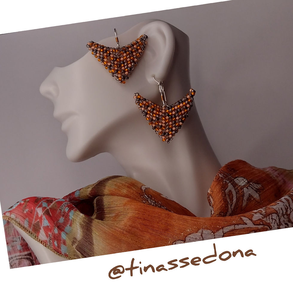 Hand woven earrings of autumn colored glass