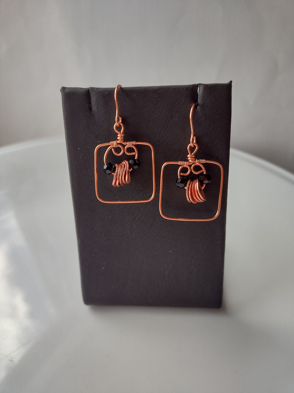 Thumbnail: Handmade square earrings of black and copper petal beads