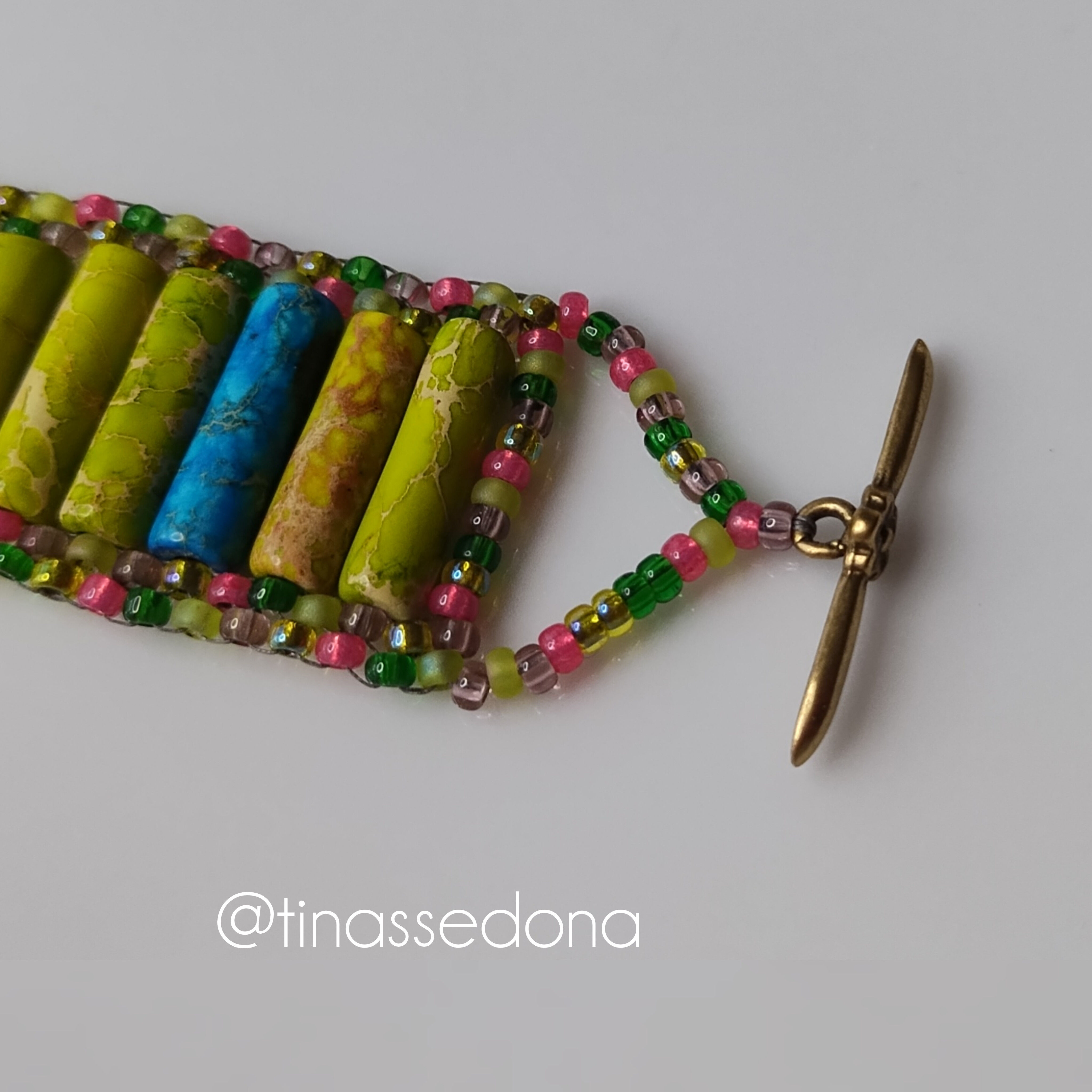 Hand beaded bracelet of multi colored jasper natural gemstone and glass